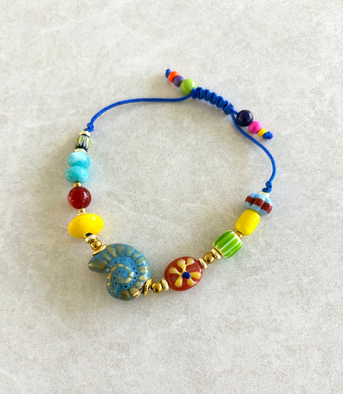 Pulsera caracola marina azul claro