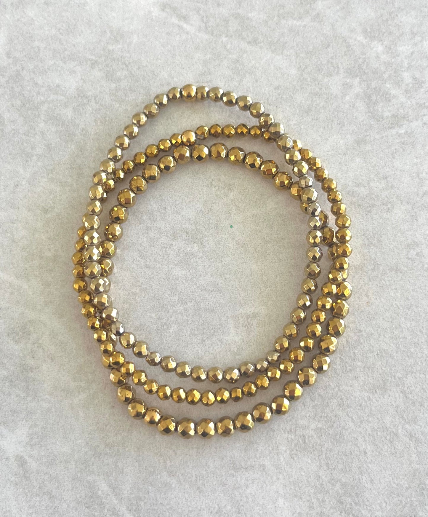 Trio pulseras hematita color bronce